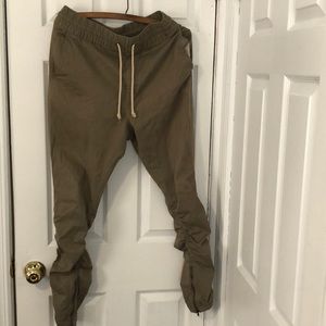 Khaki tapered zipper pants stacked
